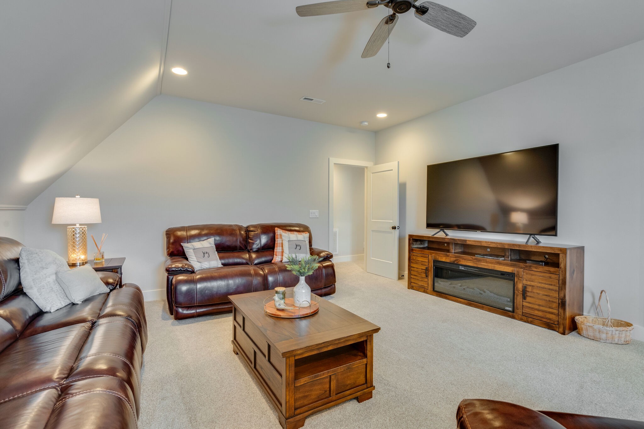 987 Carnation Drive Spring Hill, TN 37174 - Photo 20 of 26 a living room with furniture and a flat screen tv
