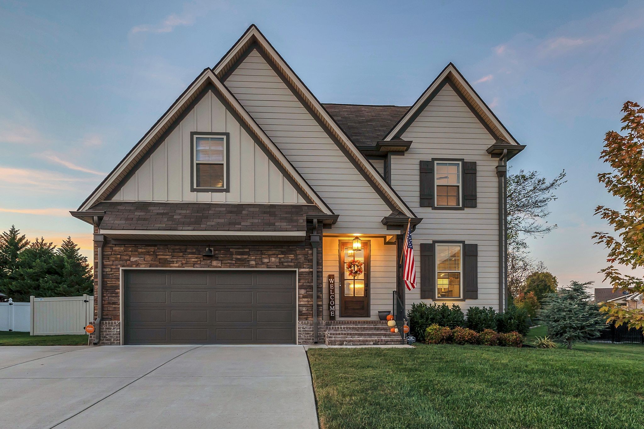 987 Carnation Drive Spring Hill, TN 37174 - Photo 2 of 26 a front view of a house with a yard and garage
