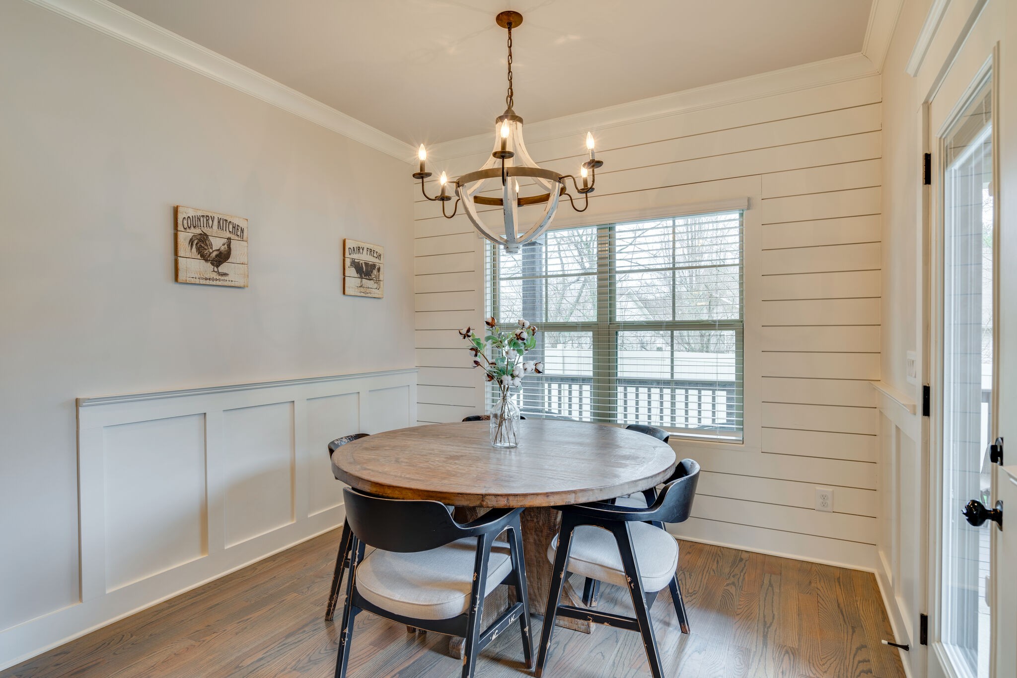987 Carnation Drive Spring Hill, TN 37174 - Photo 9 of 26 a dining room with furniture a chandelier and wooden floor