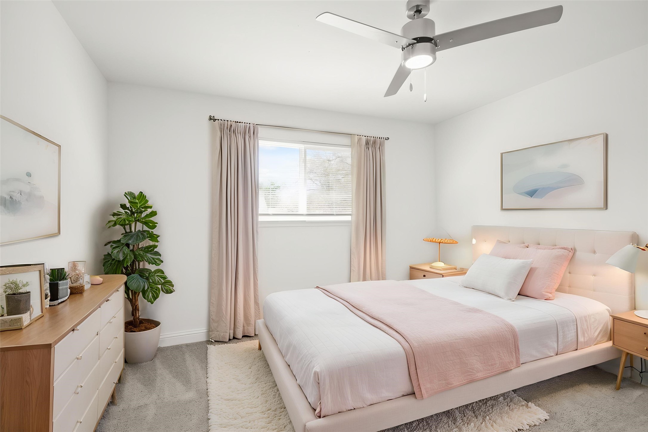 24127 Spring Fork Drive Spring, TX 77373 - Photo 13 of 17 a bedroom with a large bed and a potted plant