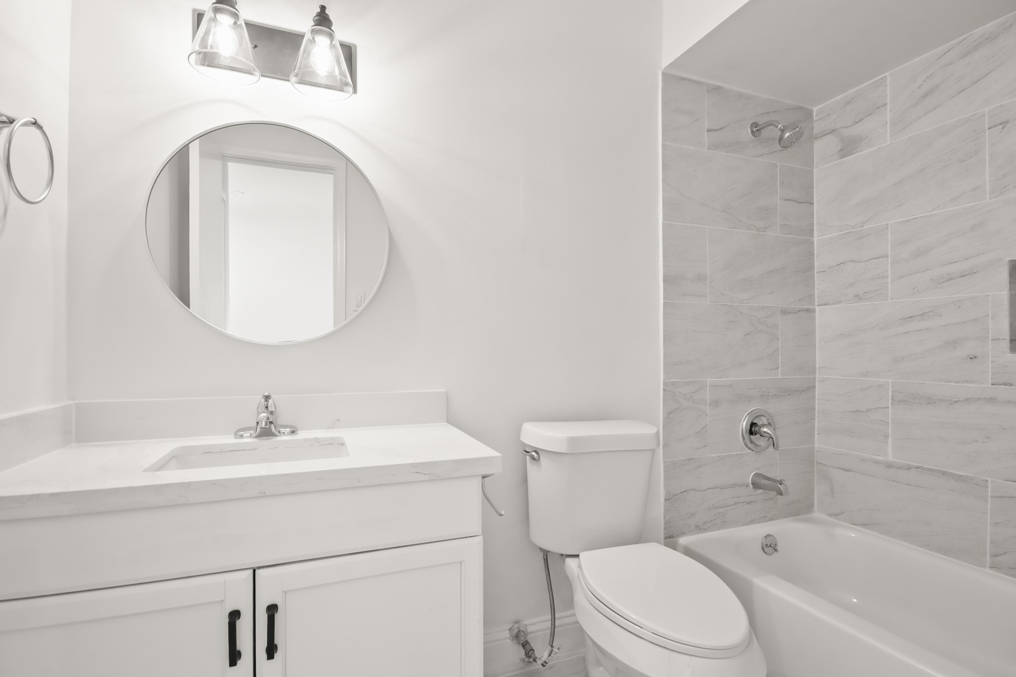 24127 Spring Fork Drive Spring, TX 77373 - Photo 16 of 17 An updated bathroom with modern fixtures, a sleek vanity, and fresh tile finishes that bring a polished look to the space.