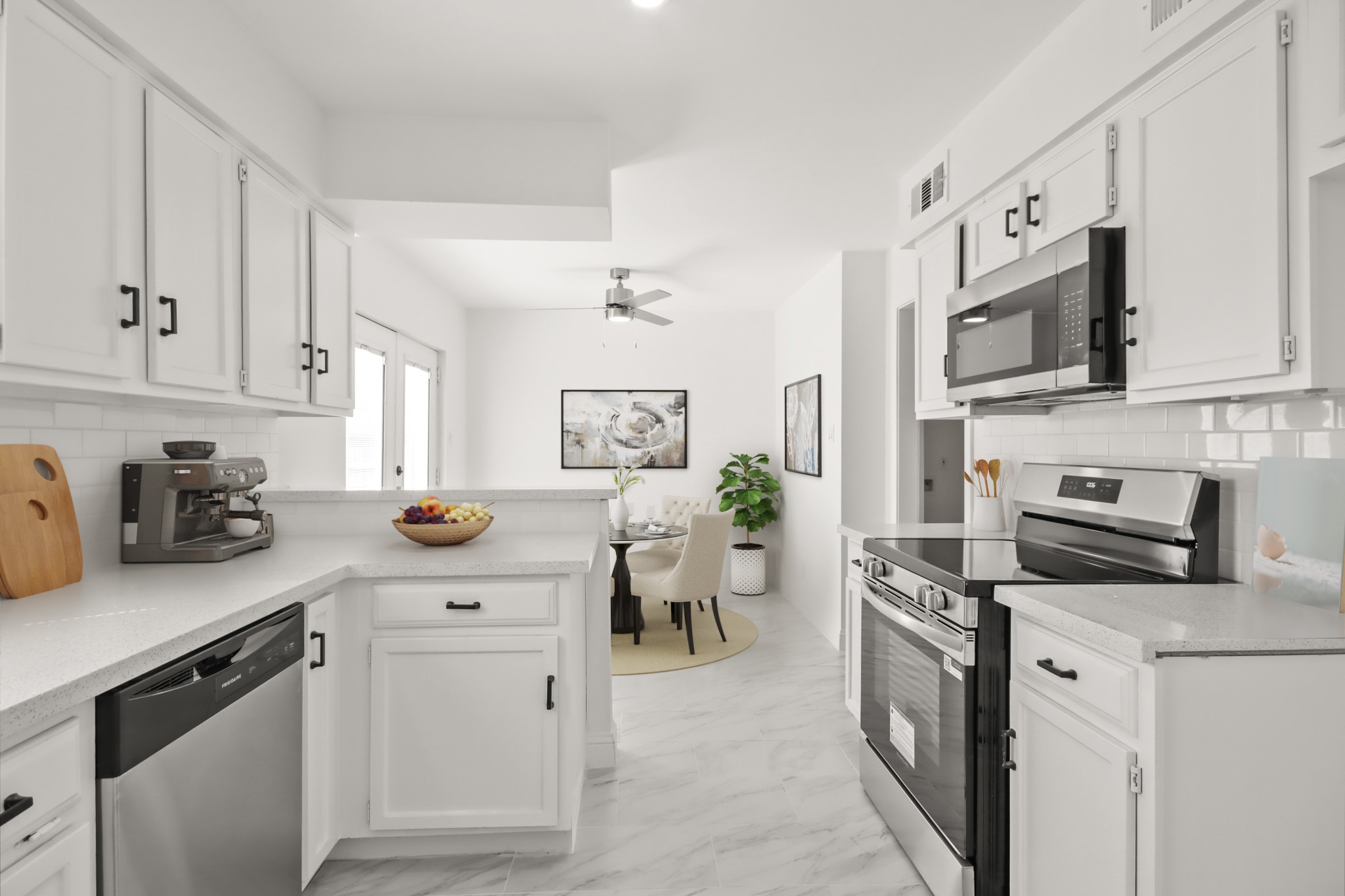 24127 Spring Fork Drive Spring, TX 77373 - Photo 7 of 17 a kitchen with stainless steel appliances a stove microwave and cabinets