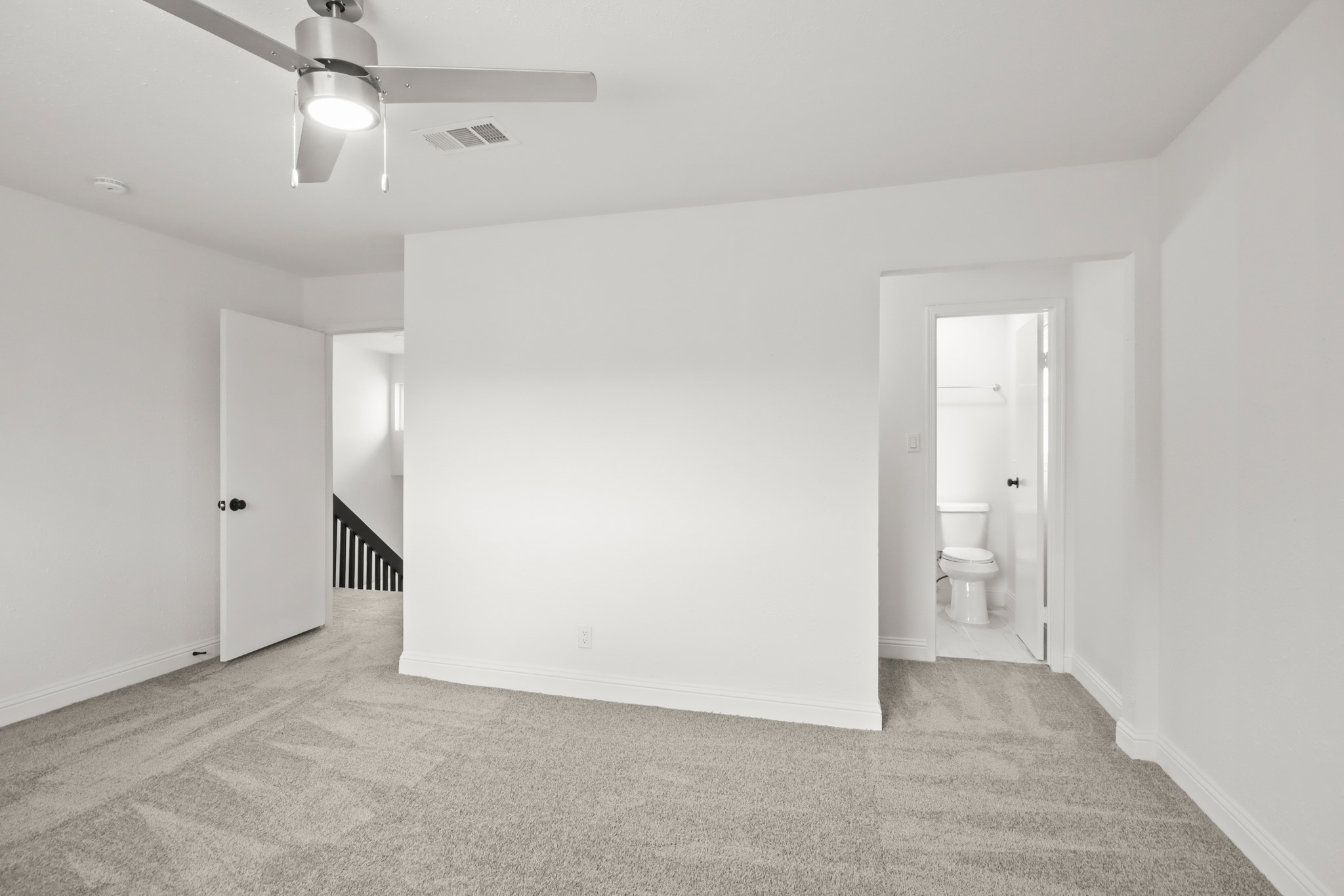 24127 Spring Fork Drive Spring, TX 77373 - Photo 10 of 17 A versatile primary suite with plenty of room to personalize, complete with ceiling fan comfort and convenient access to the ensuite bath.