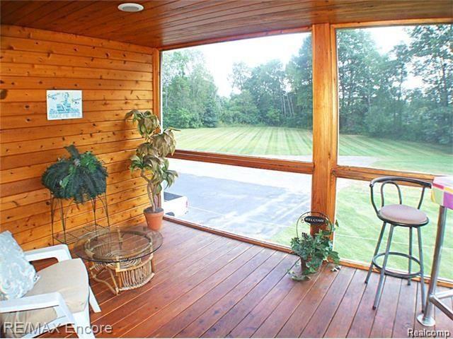 8629 Sashabaw Road Clarkston, MI 48348 - Photo 18 of 34 Screened balcony with recessed lights, stained wood ceiling and door to balcony. Fantastic place for sunset view