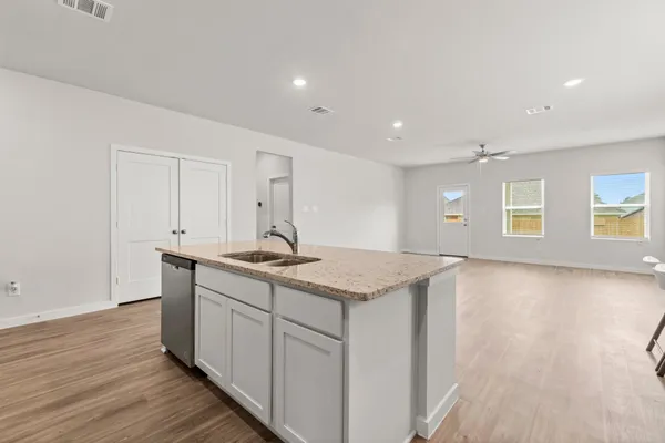 a kitchen with a sink and cabinets