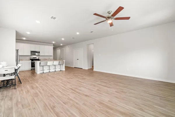 a view of kitchen with furniture and wooden floor