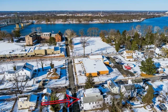 an aerial view of a houses with outdoor space