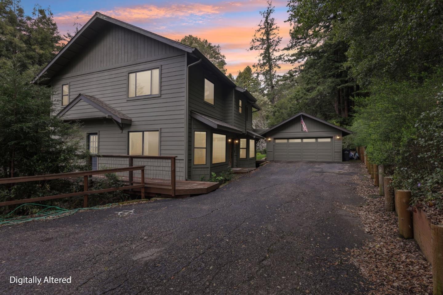 a view of house with a yard and wooden fence