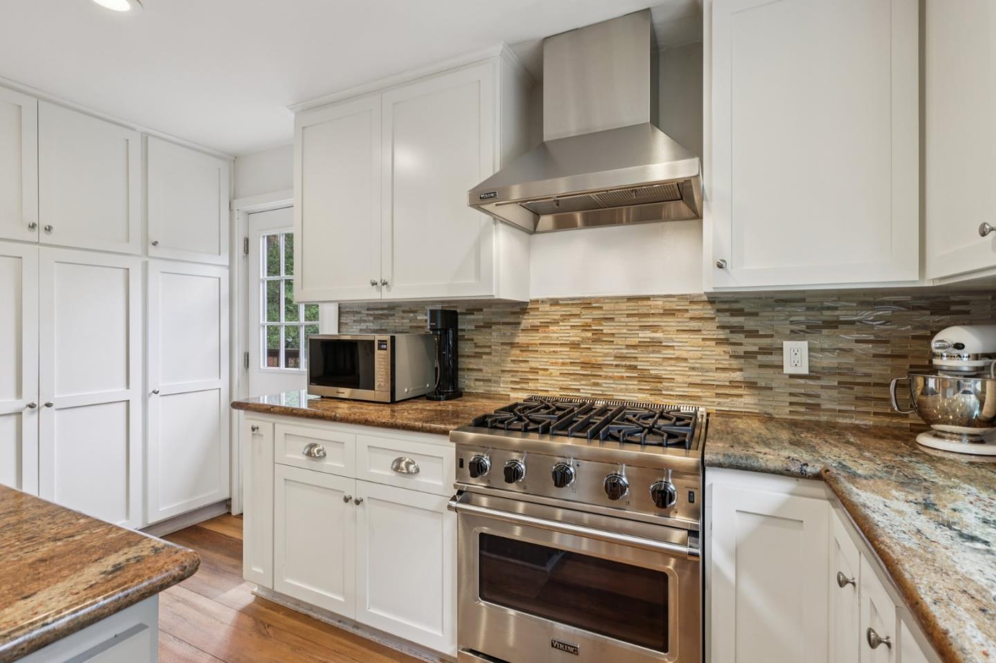 17386 Tressel Pass Road Boulder Creek, CA 95006 - Photo 12 of 41 a kitchen with granite countertop a stove sink and refrigerator