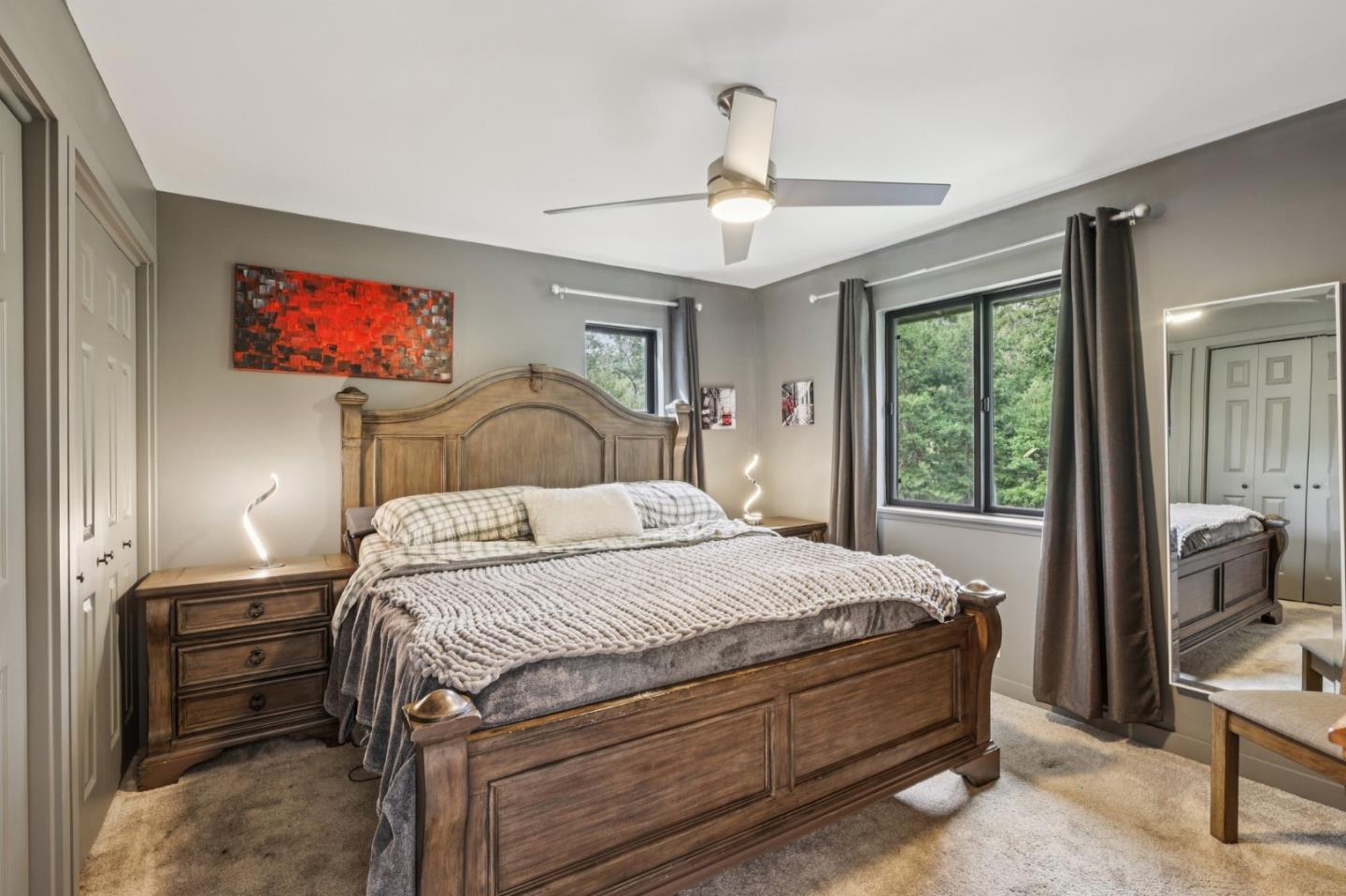 17386 Tressel Pass Road Boulder Creek, CA 95006 - Photo 14 of 41 a bedroom with a bed and a chandelier