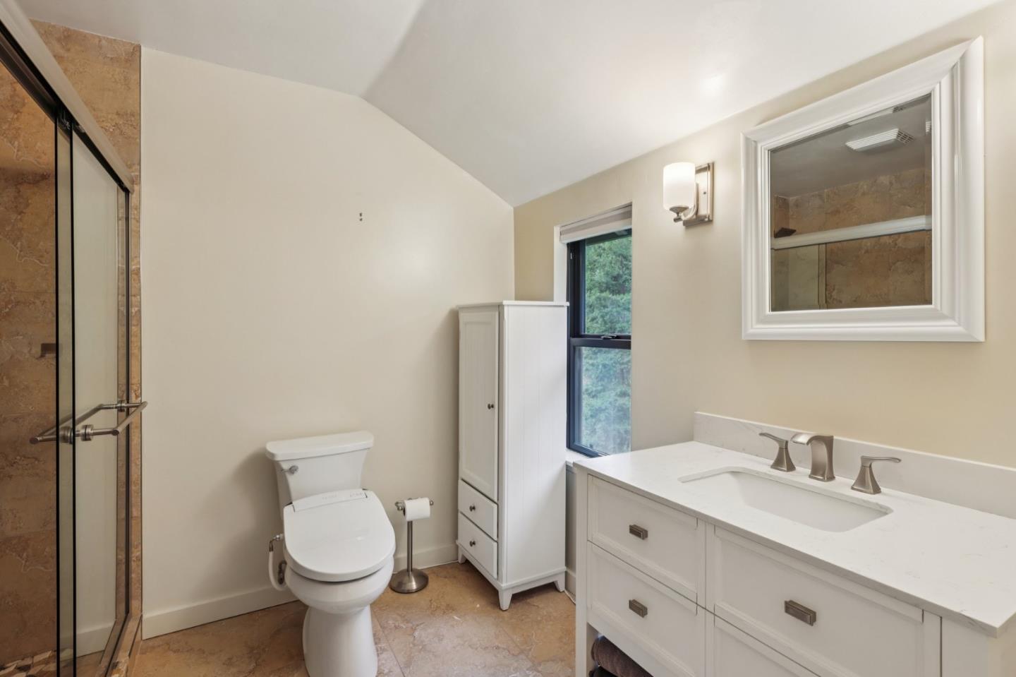 17386 Tressel Pass Road Boulder Creek, CA 95006 - Photo 18 of 41 a bathroom with a toilet sink and mirror