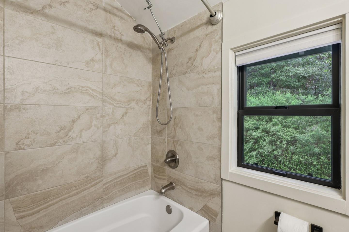 17386 Tressel Pass Road Boulder Creek, CA 95006 - Photo 23 of 41 a bathroom with a bathtub and shower
