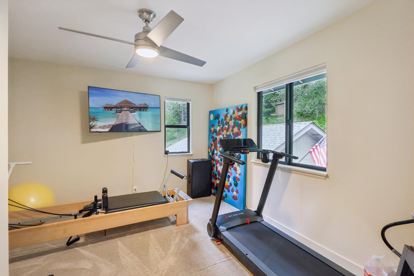 17386 Tressel Pass Road Boulder Creek, CA 95006 - Photo 24 of 41 a room with gym equipment and windows