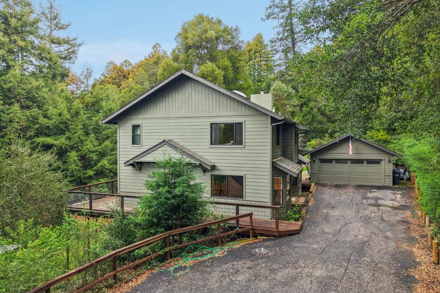 17386 Tressel Pass Road Boulder Creek, CA 95006 - Photo 40 of 41 a view of a house with a yard and large tree