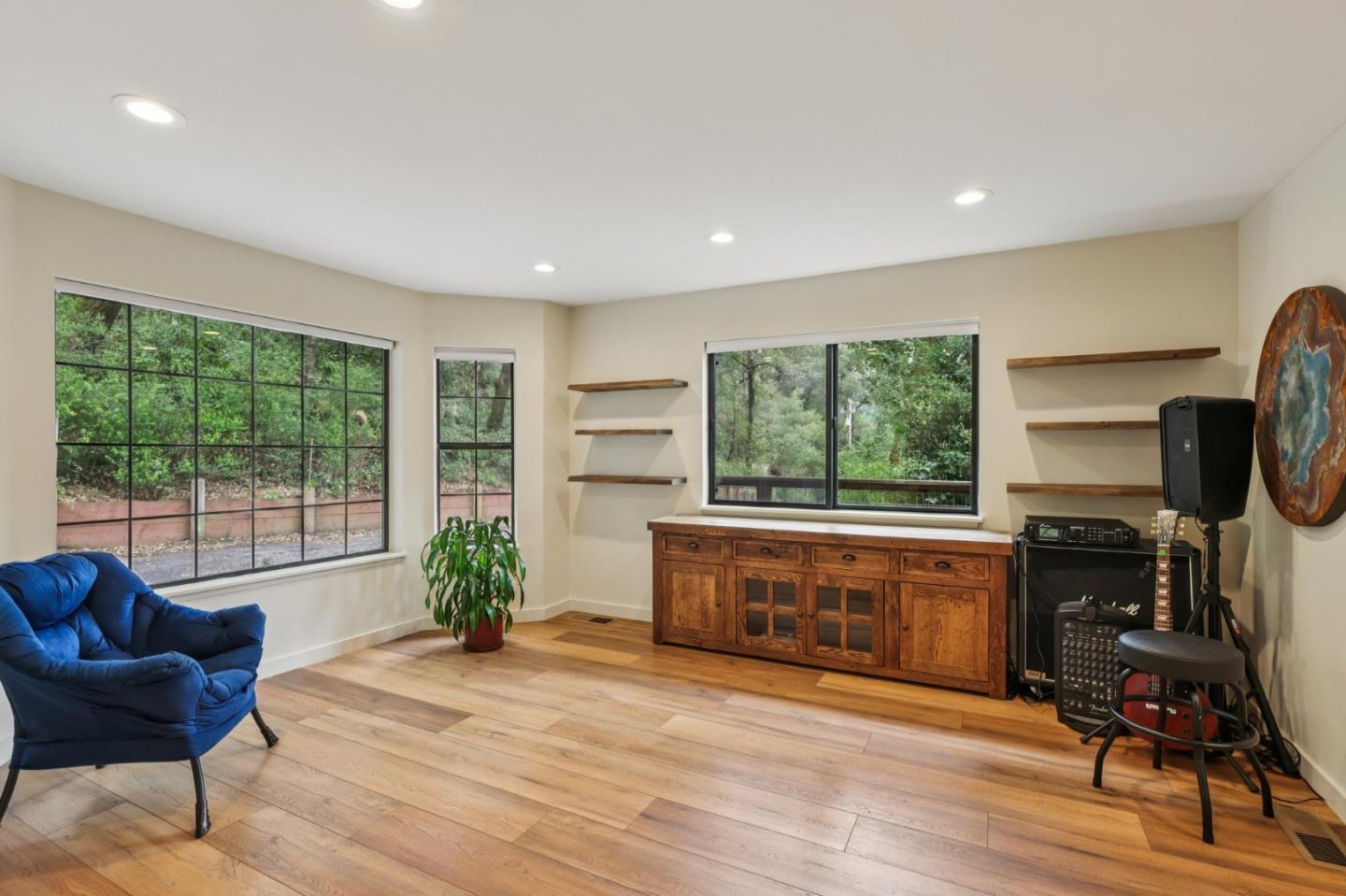 17386 Tressel Pass Road Boulder Creek, CA 95006 - Photo 4 of 41 a living room with furniture a window and a fireplace