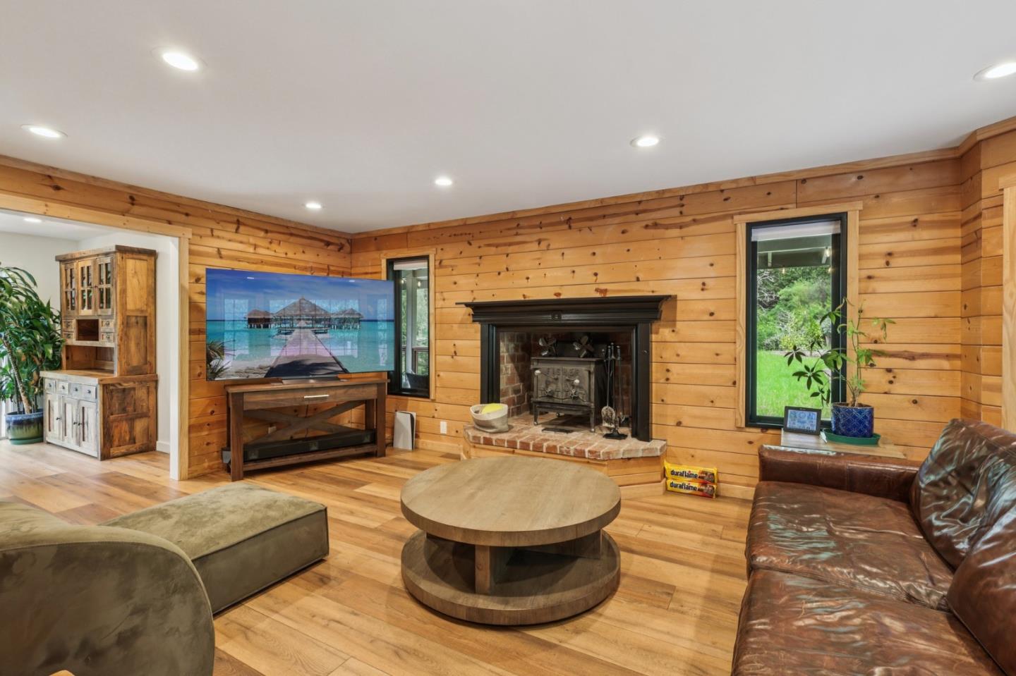 17386 Tressel Pass Road Boulder Creek, CA 95006 - Photo 6 of 41 a living room with furniture and a fireplace