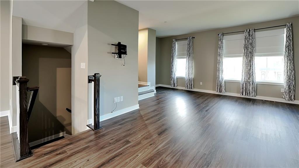 4408 Spruce Road Gibsonia, PA 15044 - Photo 11 of 40 an empty room with wooden floor and windows