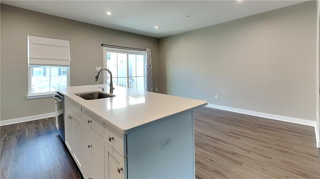 4408 Spruce Road Gibsonia, PA 15044 - Photo 14 of 40 a kitchen with sink cabinets and wooden floor