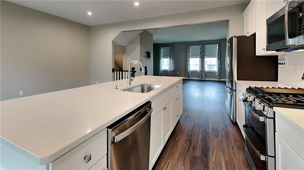 4408 Spruce Road Gibsonia, PA 15044 - Photo 15 of 40 a kitchen with a sink a stove and cabinets