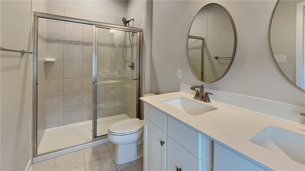 4408 Spruce Road Gibsonia, PA 15044 - Photo 24 of 40 a bathroom with a sink a toilet and a mirror