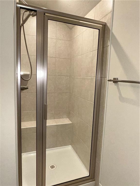4408 Spruce Road Gibsonia, PA 15044 - Photo 30 of 40 a bathroom with a glass shower door