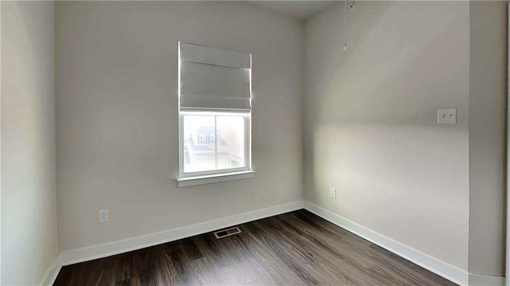 4408 Spruce Road Gibsonia, PA 15044 - Photo 36 of 40 an empty room with wooden floor and windows
