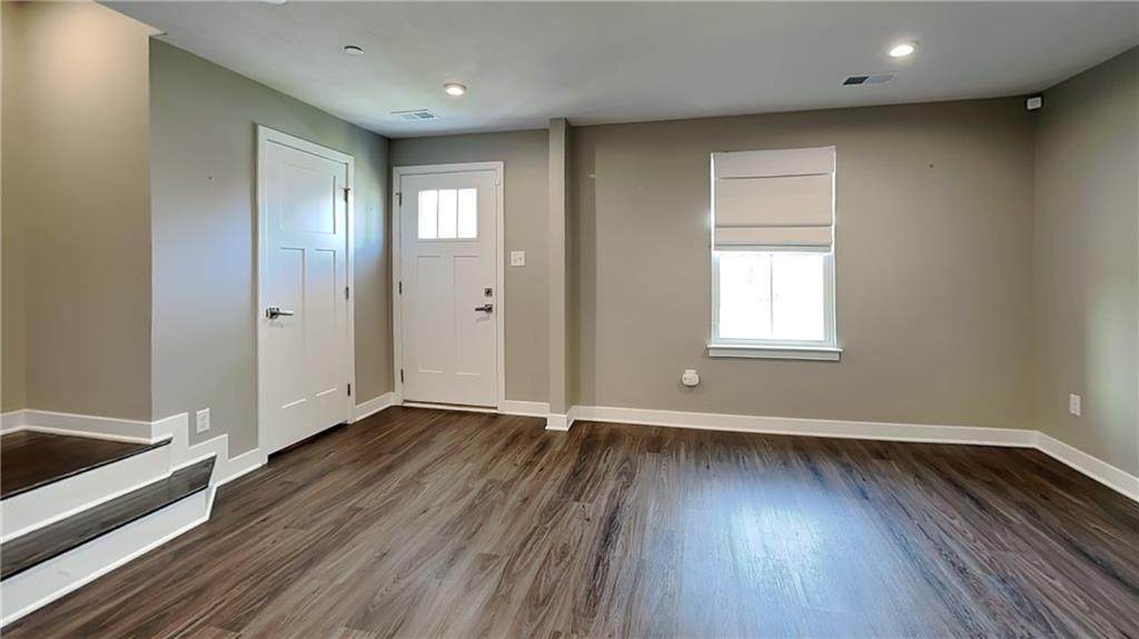 4408 Spruce Road Gibsonia, PA 15044 - Photo 4 of 40 an empty room with wooden floor and windows