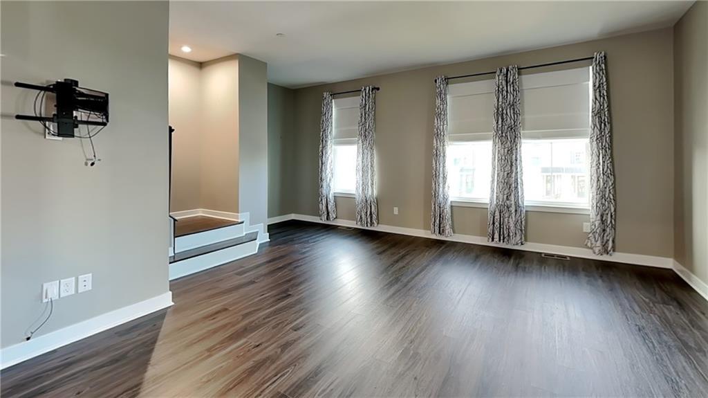 4408 Spruce Road Gibsonia, PA 15044 - Photo 9 of 40 an empty room with wooden floor and windows
