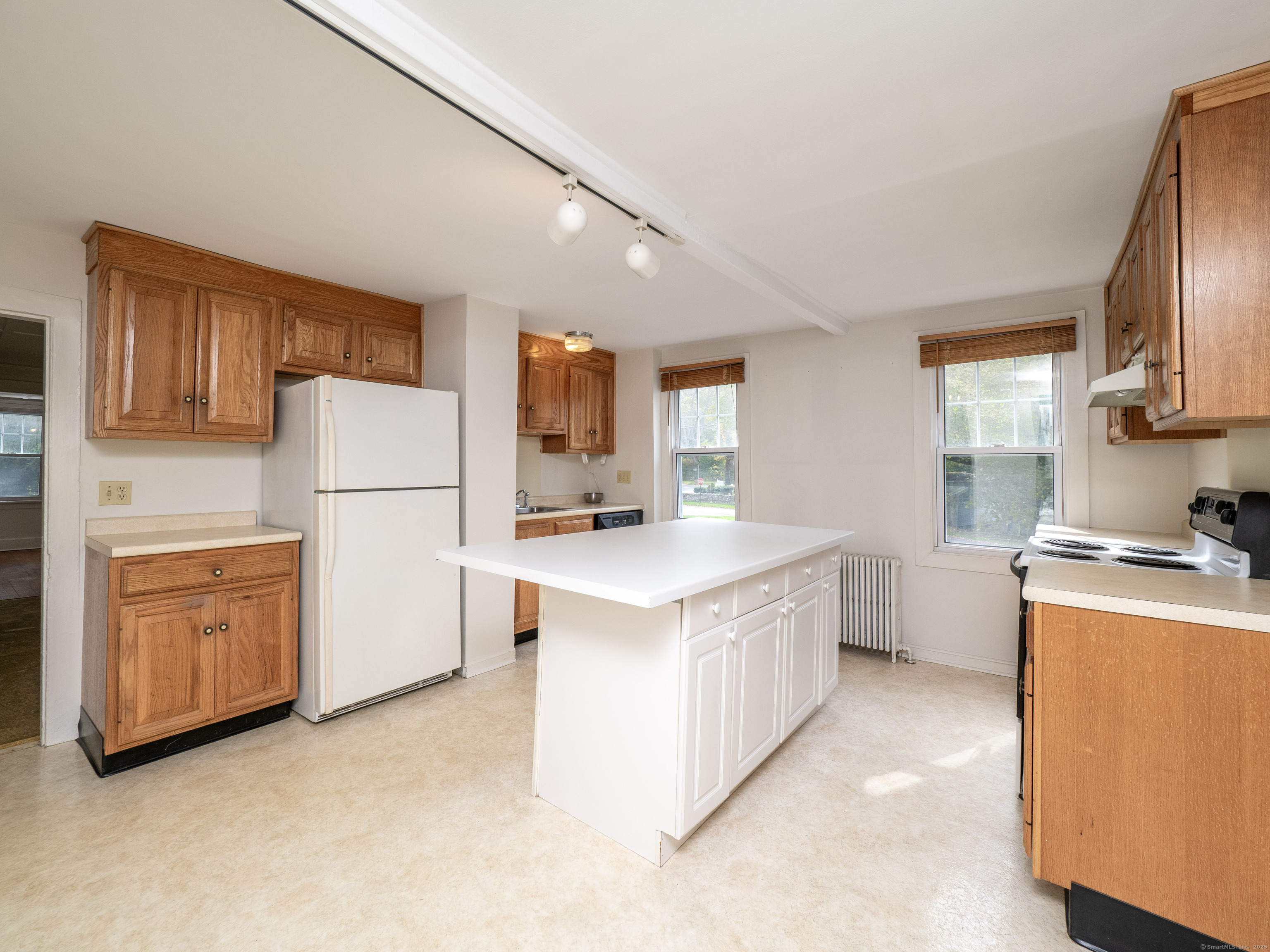 35 Ramapoo Road Ridgefield, CT 06877 - Photo 11 of 38 a kitchen with sink a stove and refrigerator
