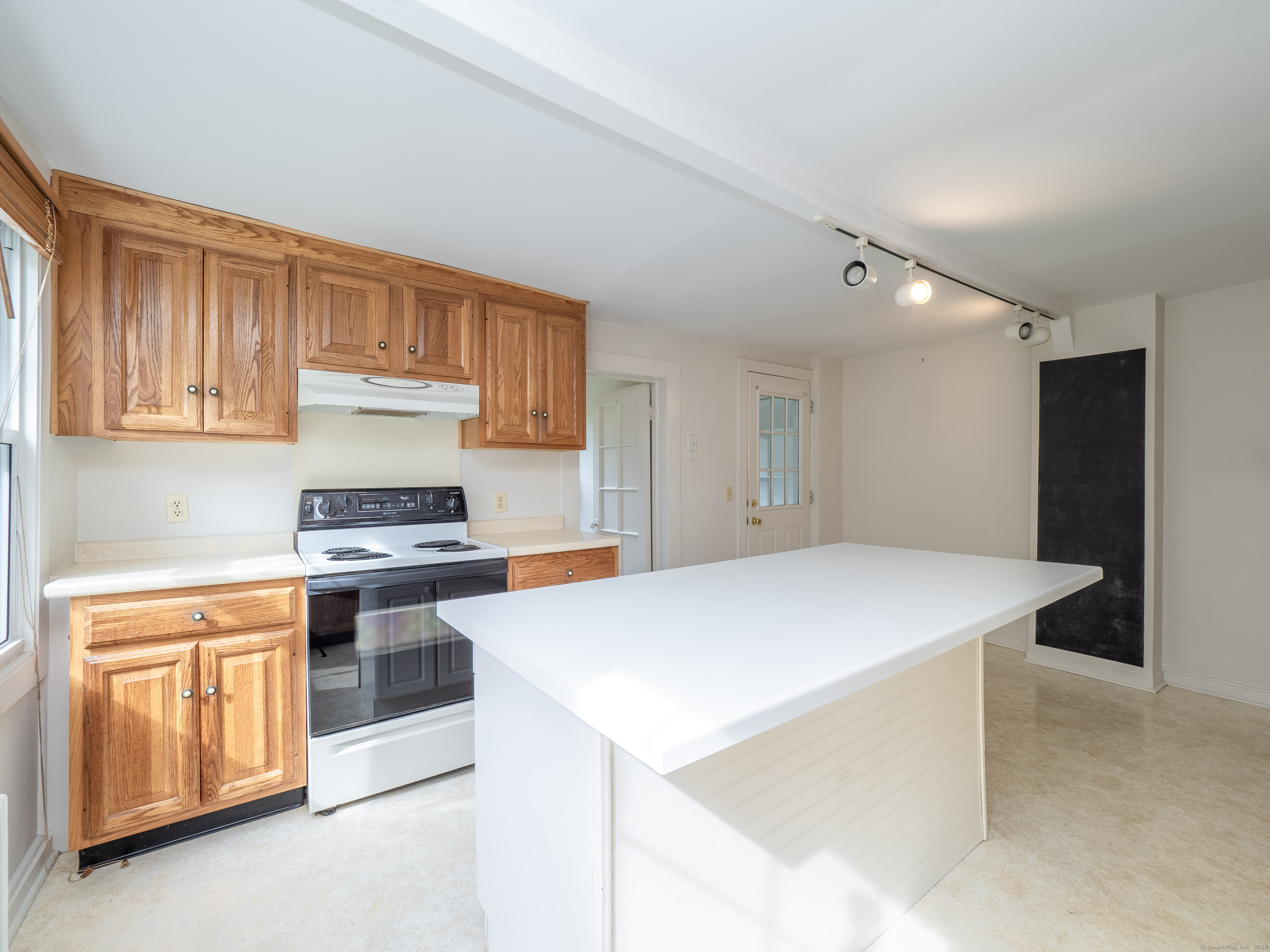 35 Ramapoo Road Ridgefield, CT 06877 - Photo 12 of 38 a kitchen that has a sink and a stove in it