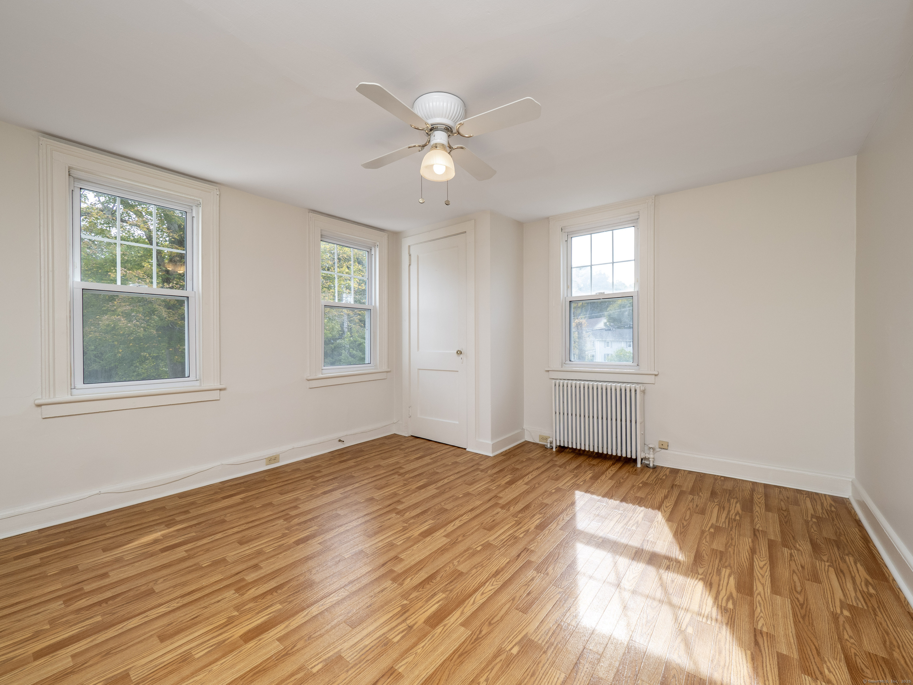 35 Ramapoo Road Ridgefield, CT 06877 - Photo 14 of 38 a view of an empty room with wooden floor and a window