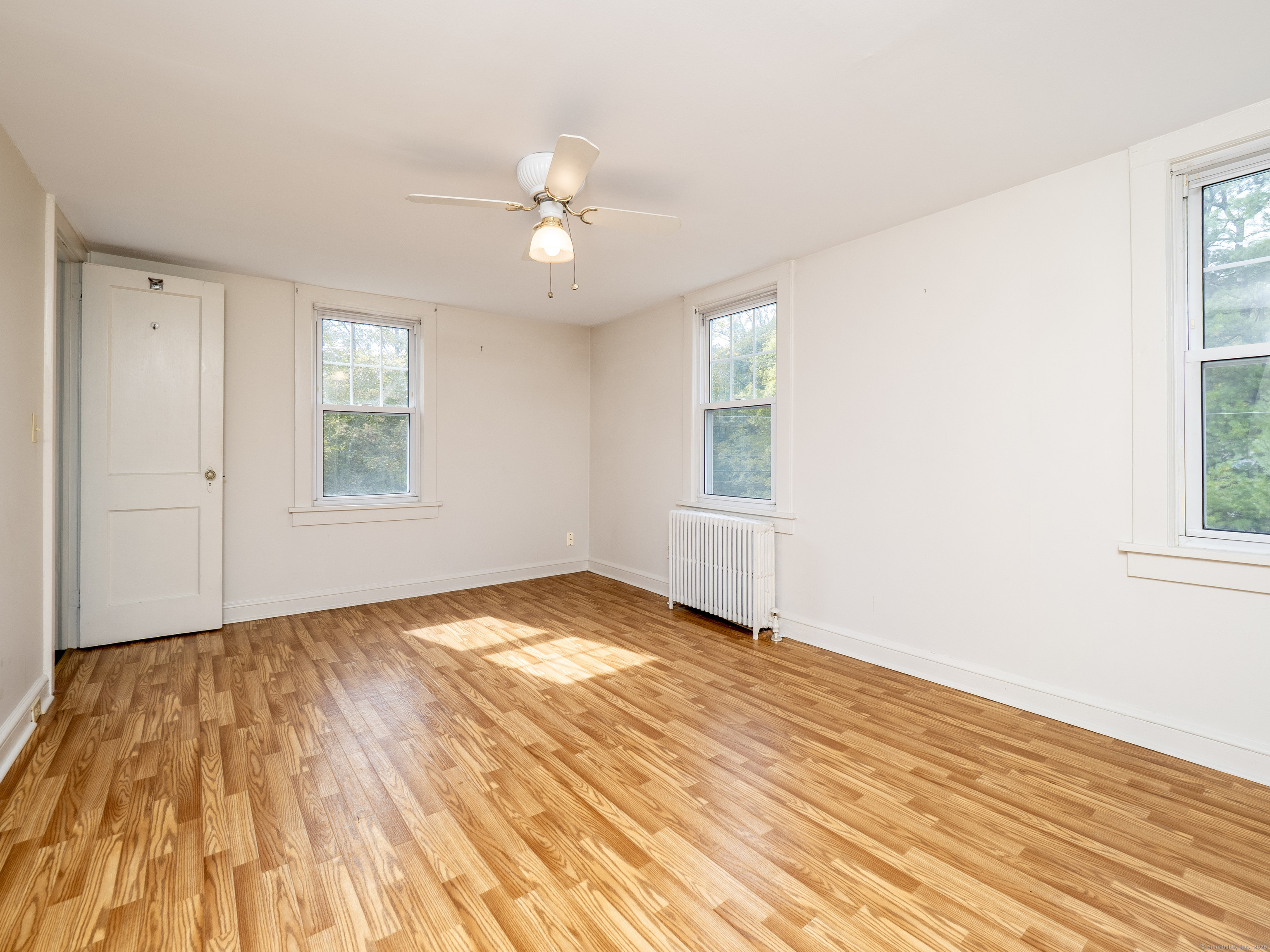 35 Ramapoo Road Ridgefield, CT 06877 - Photo 20 of 38 wooden floor in an empty room with a window