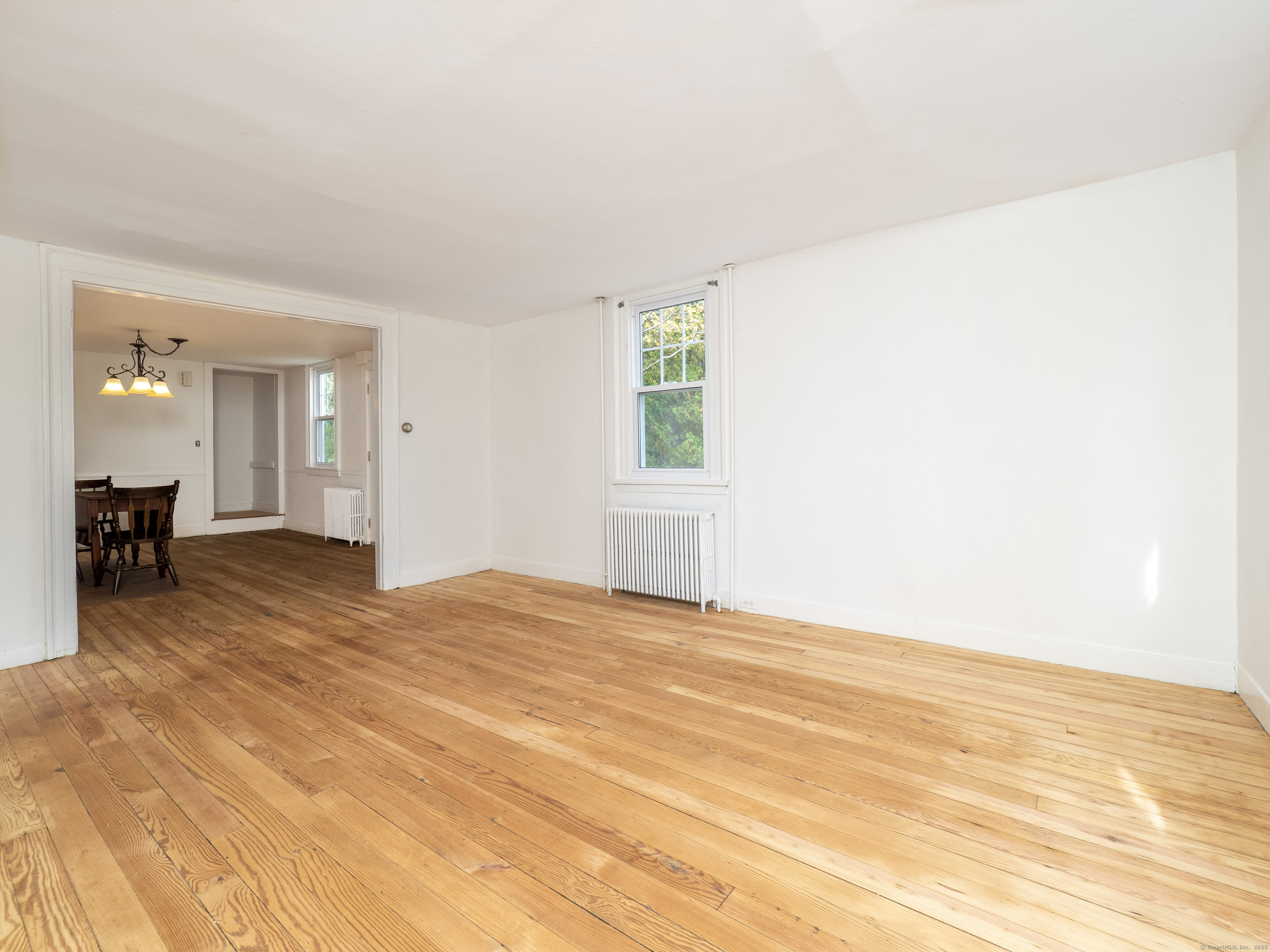 35 Ramapoo Road Ridgefield, CT 06877 - Photo 26 of 38 a view of an empty room with wooden floor and a window