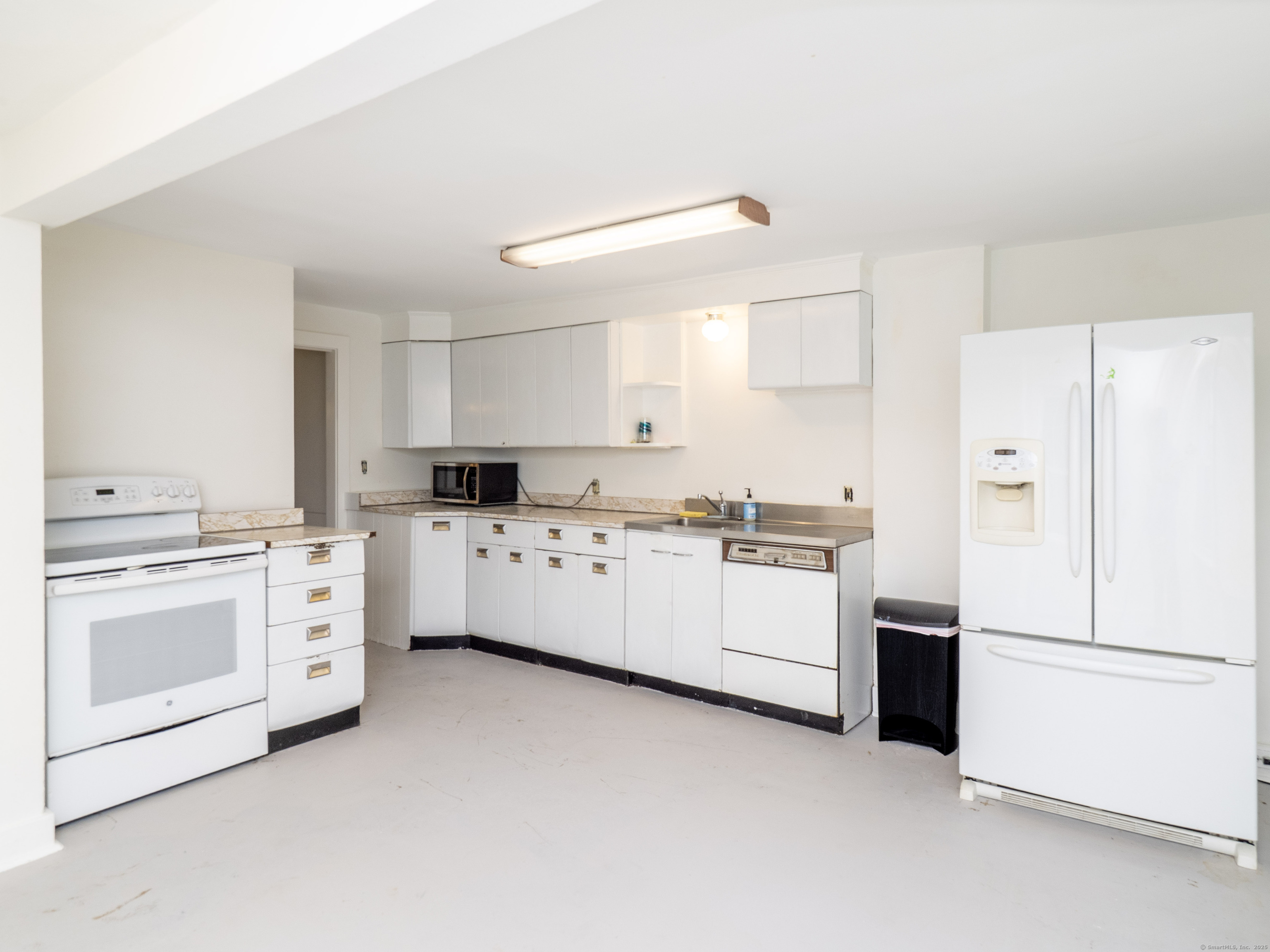 35 Ramapoo Road Ridgefield, CT 06877 - Photo 28 of 38 a kitchen with cabinets stainless steel appliances and sink
