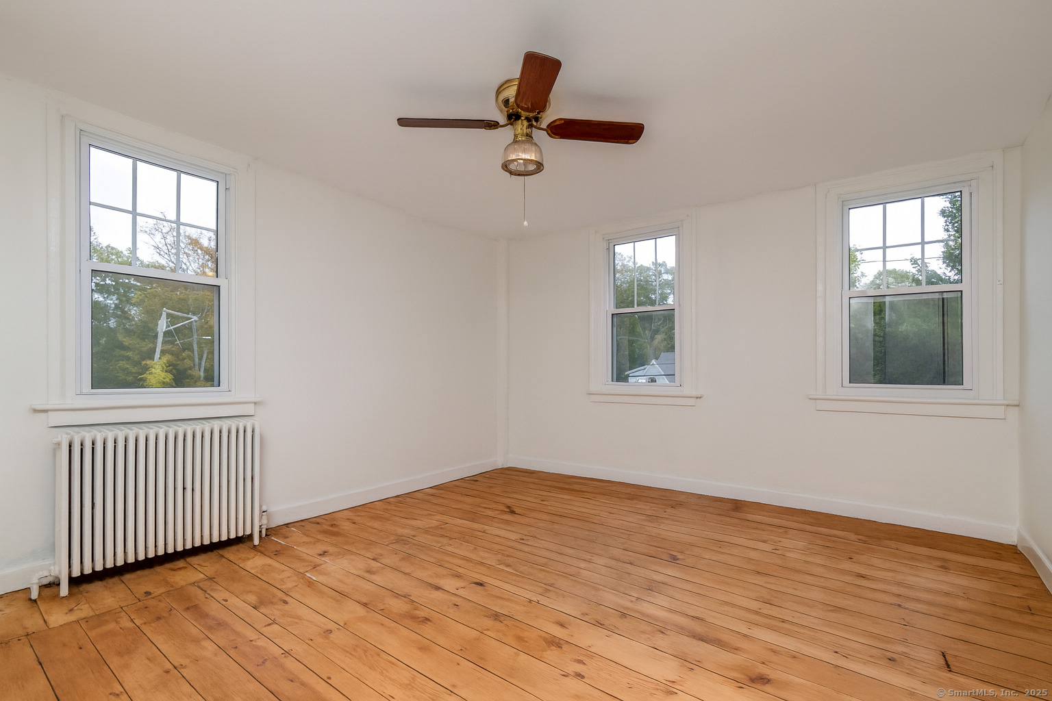35 Ramapoo Road Ridgefield, CT 06877 - Photo 31 of 38 a view of empty room with wooden floor and fan