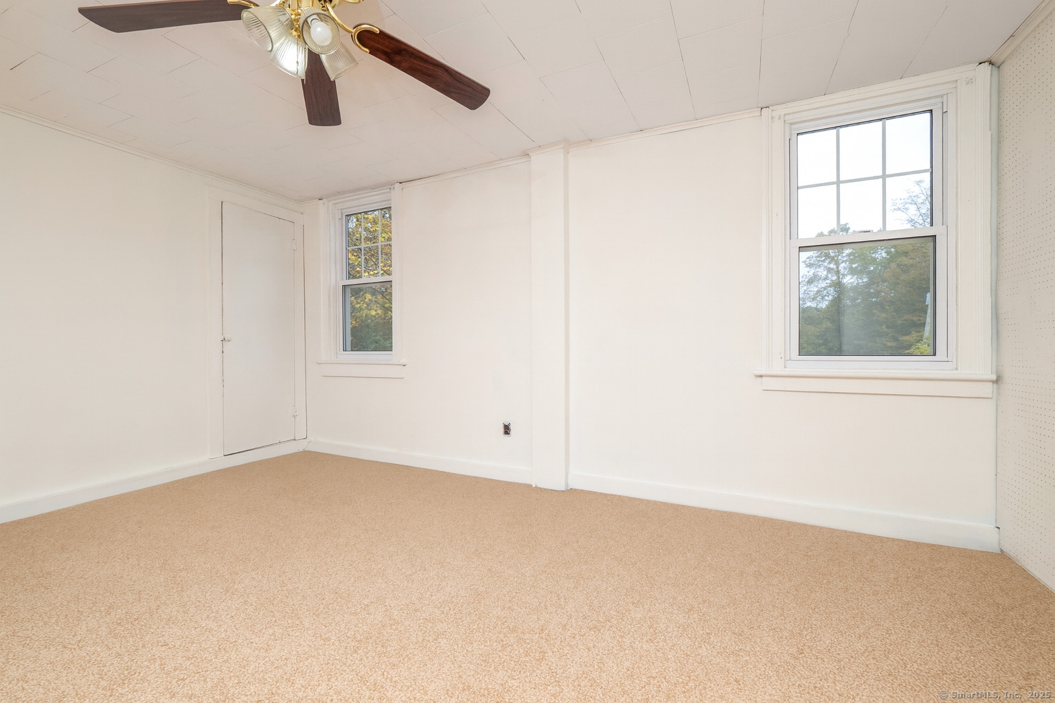 35 Ramapoo Road Ridgefield, CT 06877 - Photo 33 of 38 an empty room with windows and fan