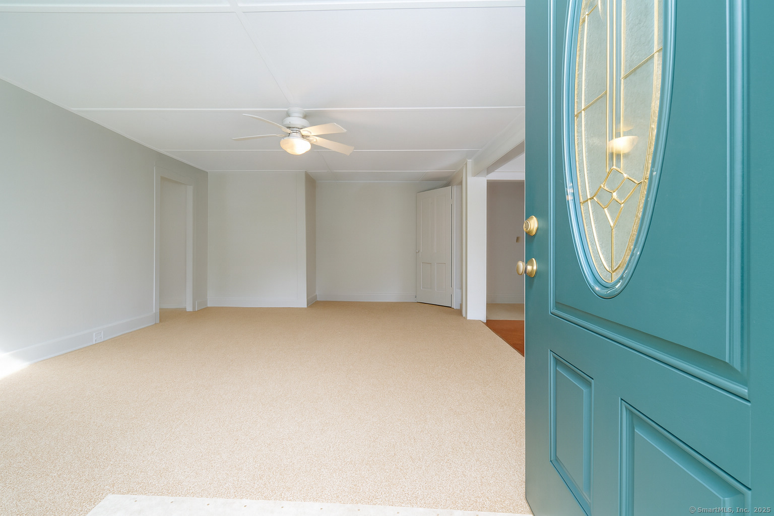 35 Ramapoo Road Ridgefield, CT 06877 - Photo 7 of 38 an empty room with mirror and a fan