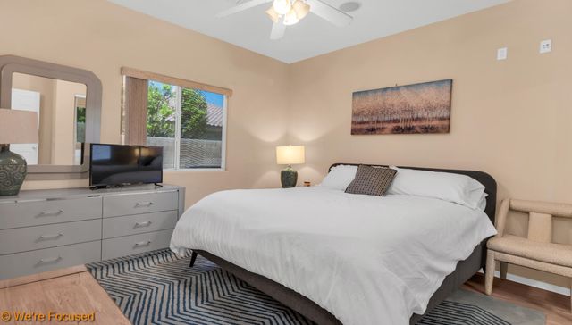 a room with a bed and a chandelier