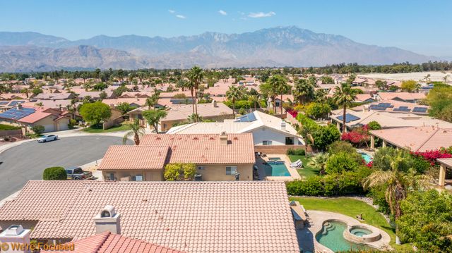 an aerial view of a house with a garden