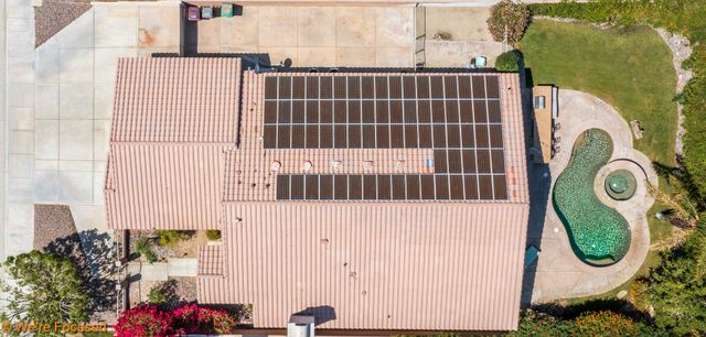a view of a house with a sign on the wall