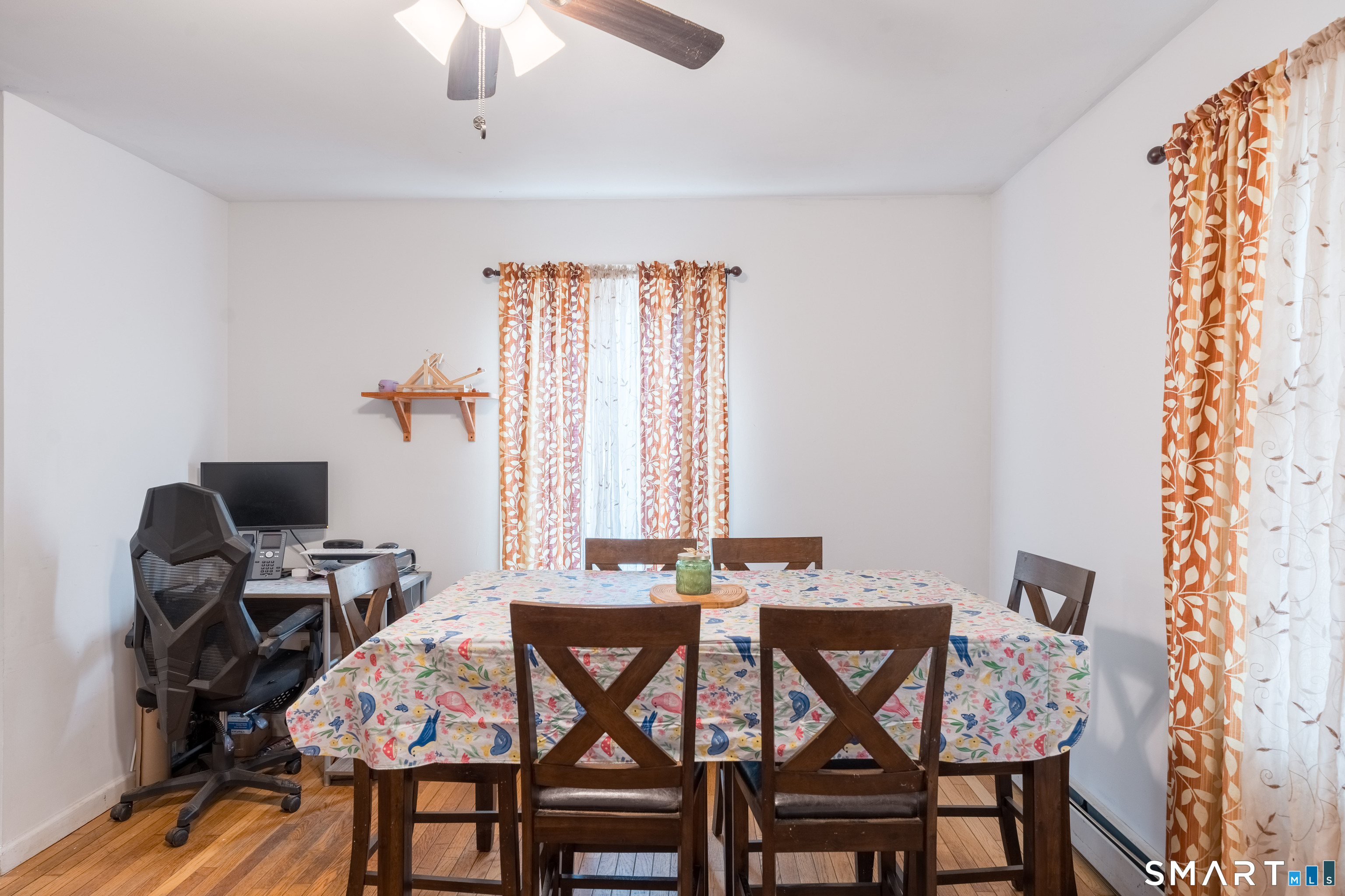 379 Christian Hill Road Brooklyn, CT 06234 - Photo 12 of 40 a view of a dining room with furniture and a window