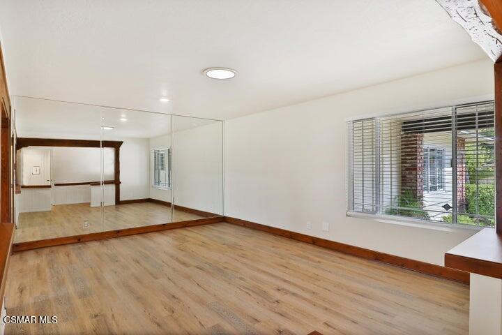 2379 Welcome Court Simi Valley, CA 93063 - Photo 18 of 49 a view of an empty room with wooden floor and a window