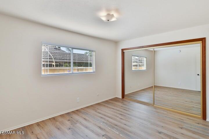 2379 Welcome Court Simi Valley, CA 93063 - Photo 36 of 49 a view of an empty room with wooden floor and a window