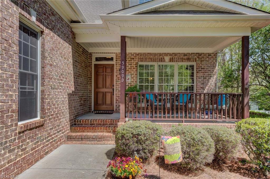 A welcoming covered front porch.  The home is located at the end of a cul-de-sac.