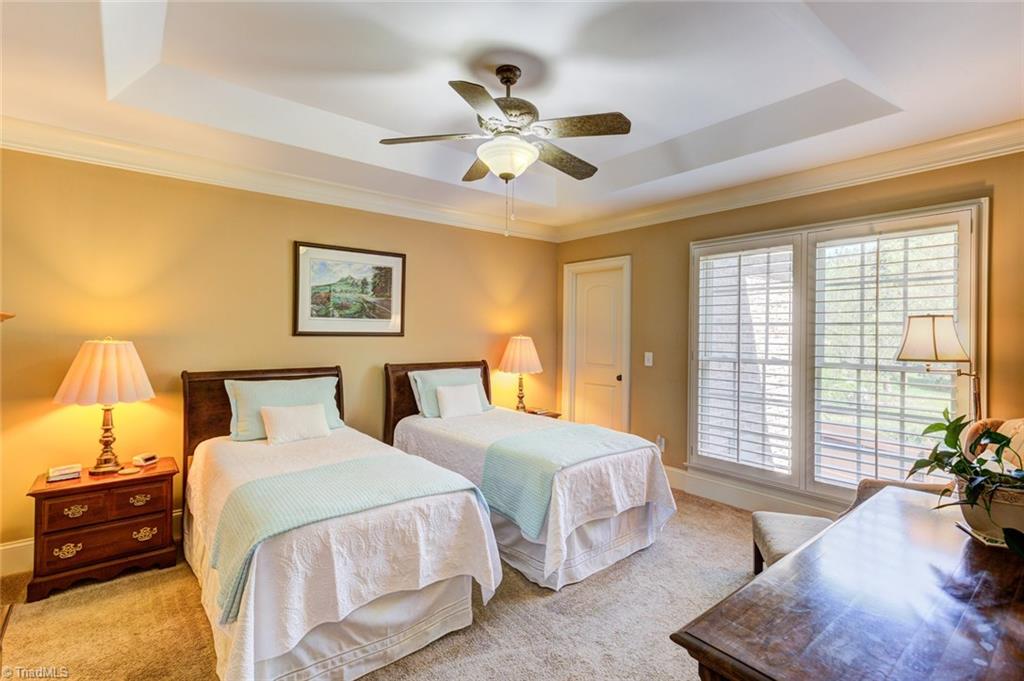 5909 Ballinger Road, Unit D Greensboro, NC 27410 - Photo 15 of 30 Main level master bedroom suite.