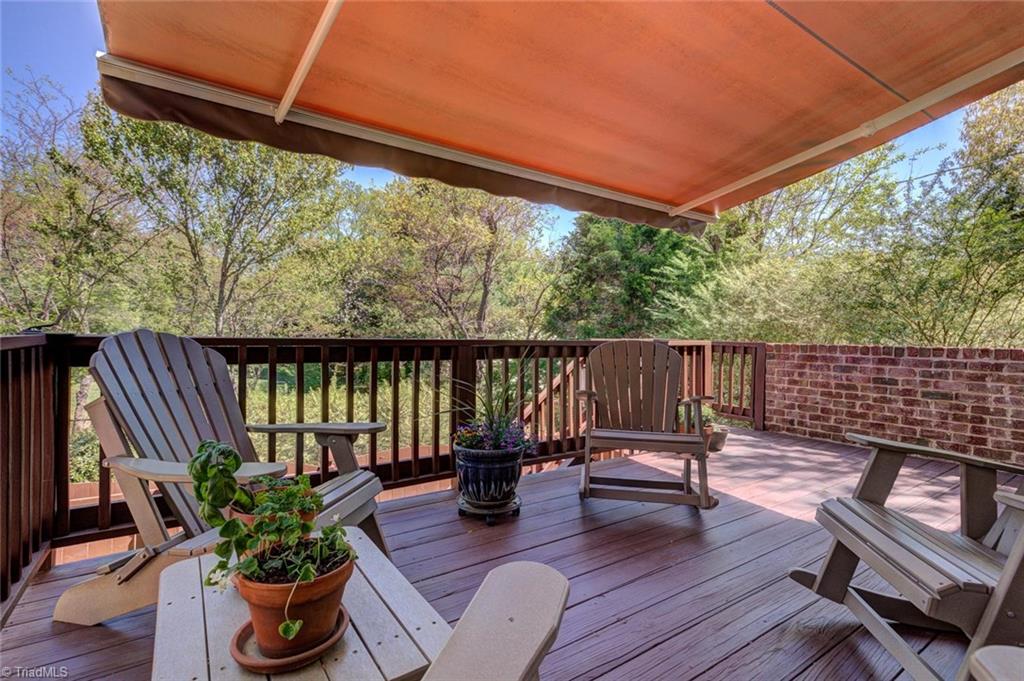 5909 Ballinger Road, Unit D Greensboro, NC 27410 - Photo 28 of 30 Wonderful deck space with awning to shade you and your guests.