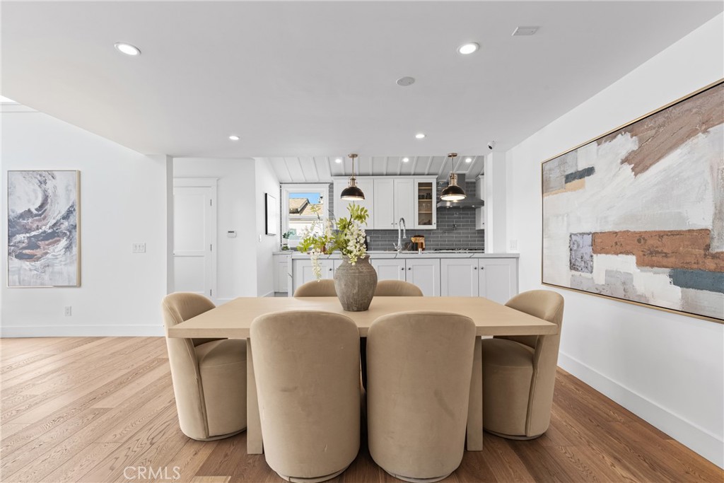 12947 La Maida Street Sherman Oaks, CA 91423 - Photo 11 of 31 a living room with stainless steel appliances kitchen island granite countertop furniture and a wooden floor