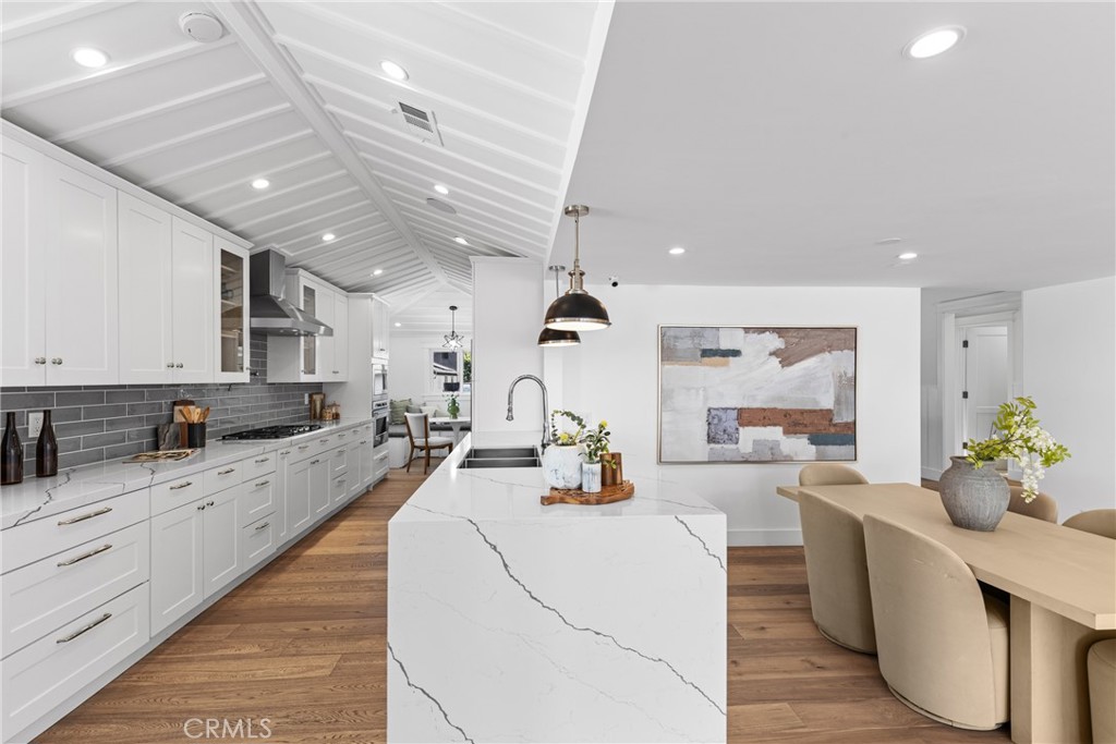 12947 La Maida Street Sherman Oaks, CA 91423 - Photo 13 of 31 a large white kitchen with lots of counter space a sink and appliances