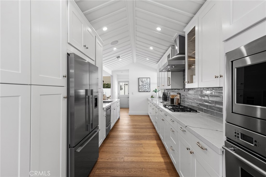 12947 La Maida Street Sherman Oaks, CA 91423 - Photo 14 of 31 a large kitchen with a large counter top stainless steel appliances and cabinets