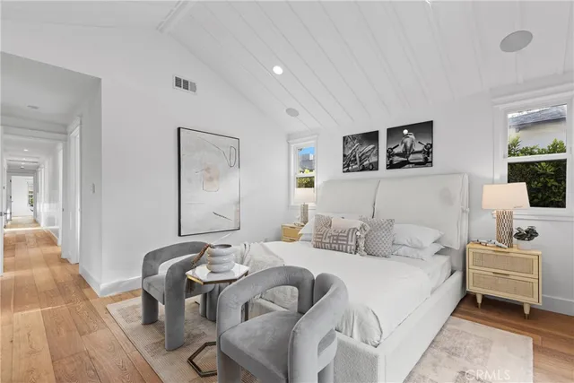 a bedroom with a bed and a couch